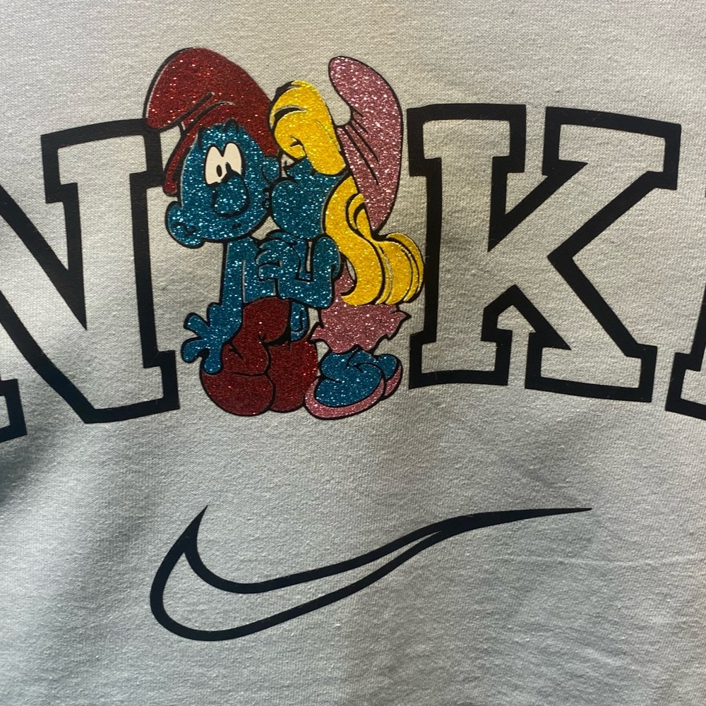 Smurfs Done in Glitter BRAND NEW  Graphic Tee Size Medium Baby blue tees